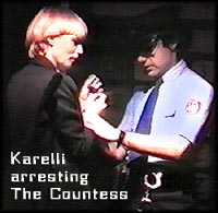 Scene from THE KID: Sgt. Karelli arresting the Countess